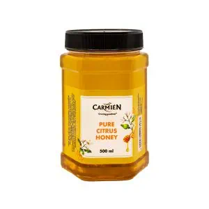 Rich, golden jar of Carmién Pure Citrus Honey featuring a black screw cap, highlighting natural lemon and orange blossom flavor, crafted by South African farmers for authentic, healthy honey.