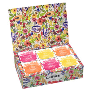 Carmién Rooibos tea gift box assortment with colorful floral packaging, opened to reveal 12 individually labeled tea sachets in vibrant colors.