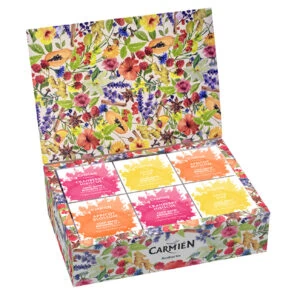 Carmién Rooibos tea gift box assortment with colorful floral packaging, opened to reveal 12 individually labeled tea sachets in vibrant colors.