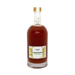 Rich honeybush herbal tea in a glass bottle with golden cap, promoting natural wellness and antioxidants.