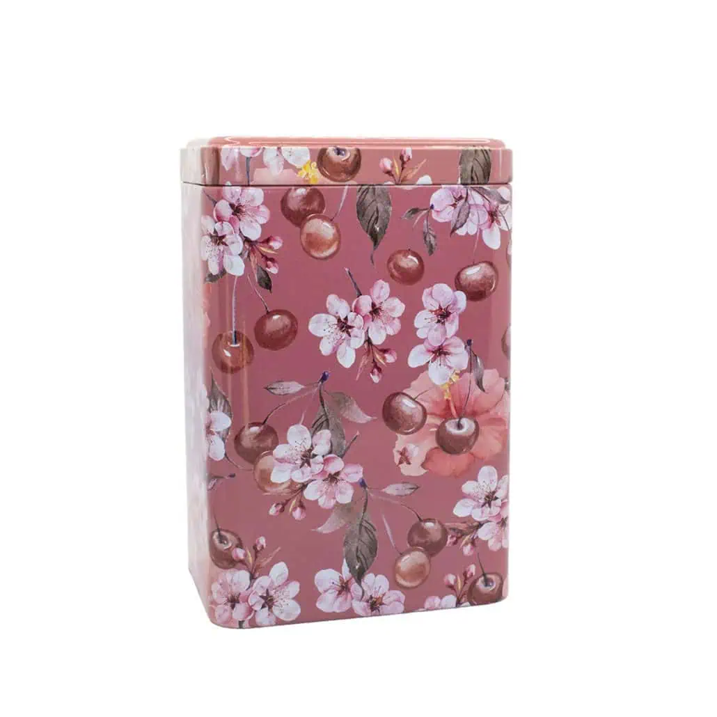 Delicious Carmién Tea in a floral cherry blossom and cherry design tea tin, perfect for gifting or storing premium herbal teas from South Africa.