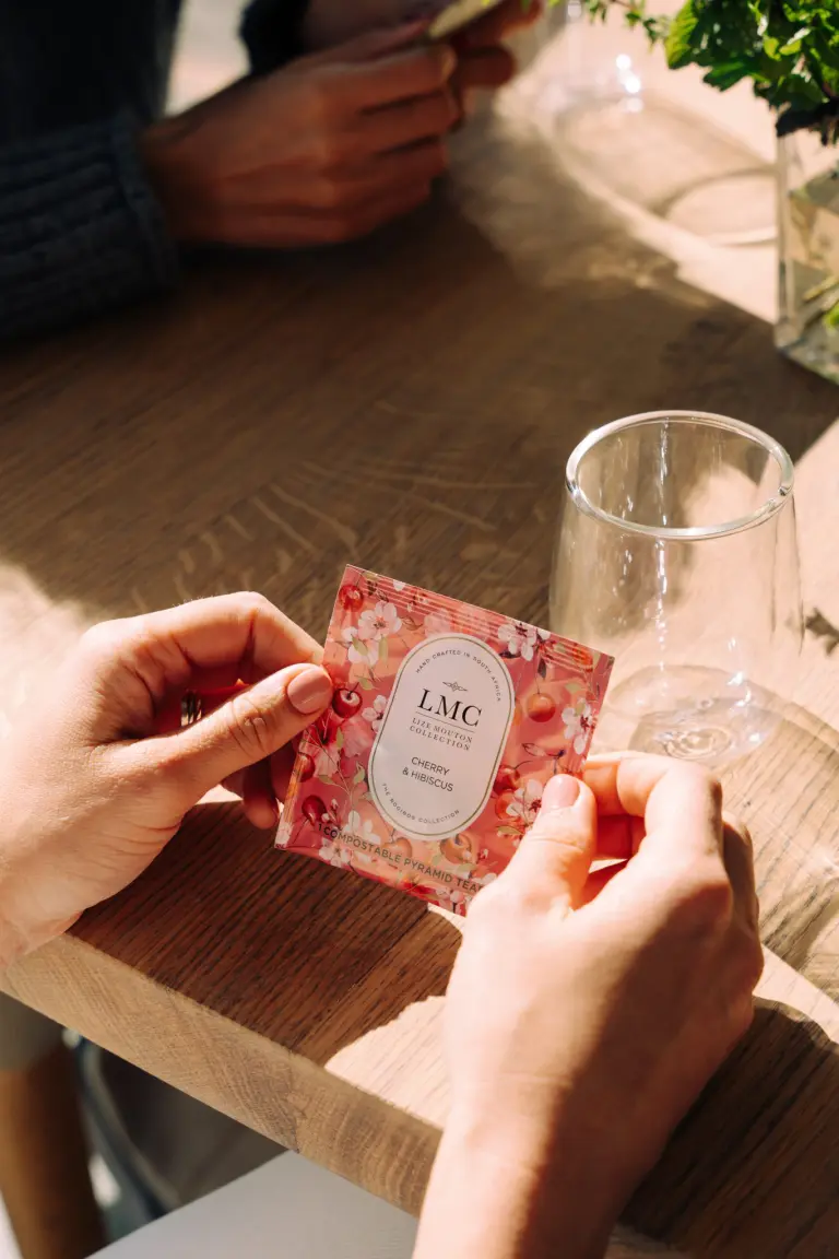 Organic CarmiƩn Tea, herbal tea from South Africa, made with rooibos, honeybush, and natural ingredients, promoting health and wellness, eco-friendly, and handcrafted.