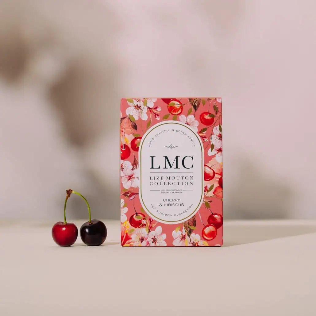 Cherry and hibiscus flavoured tea box from Carmién Tea, showcasing South African herbal tea, eco-friendly packaging, and natural ingredients for a refreshing health boost.