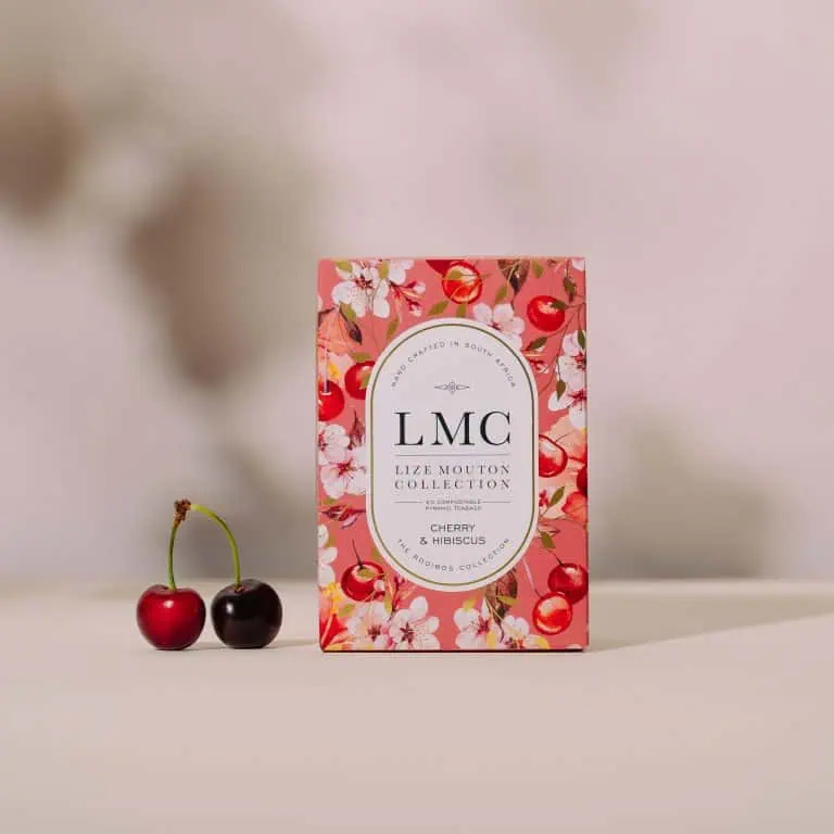Cherry and hibiscus flavoured tea box from Carmién Tea, showcasing South African herbal tea, eco-friendly packaging, and natural ingredients for a refreshing health boost.