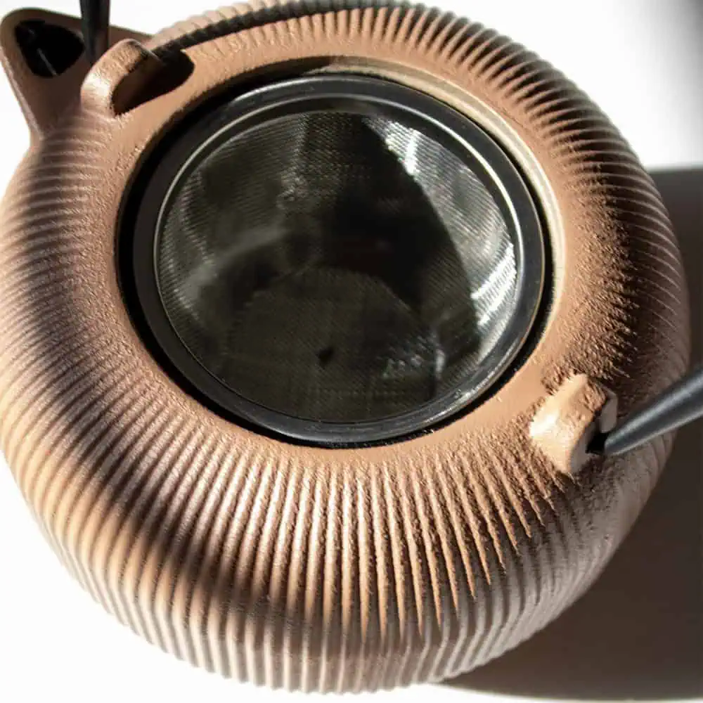 Elegant LMC Cast Iron Teapot in Sandstone finish, perfect for brewing and serving tea with style and durability.