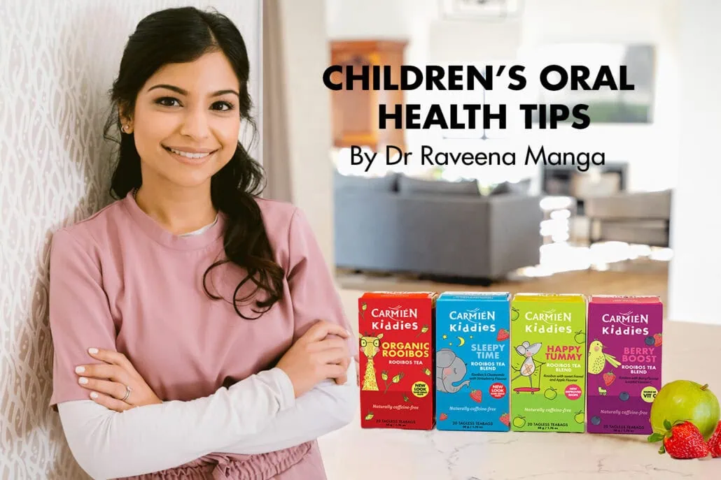 Young girl smiling confidently with a variety of Carmién Tea herbal products displayed on the table, promoting healthy lifestyle choices and natural wellness for children.
